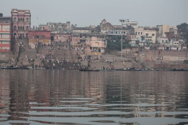 VARANASI, INDIA - DECEMBER 20: Hindus perform ritual puja at dawn in the Ganges River on December 20, 2007 in Varanasi, India