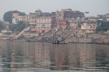 VARANASI, INDIA - DECEMBER 20: Hindus perform ritual puja at dawn in the Ganges River on December 20, 2007 in Varanasi, India