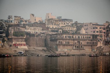 VARANASI, INDIA - DECEMBER 20: Hindus perform ritual puja at dawn in the Ganges River on December 20, 2007 in Varanasi, India