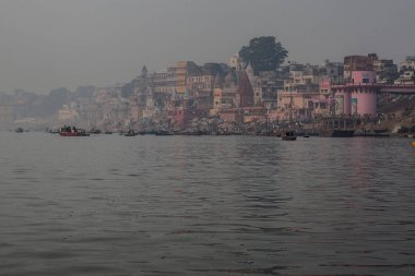 VARANASI, INDIA - DECEMBER 20: Hindus perform ritual puja at dawn in the Ganges River on December 20, 2007 in Varanasi, India