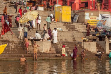 VARANASI, INDIA - NOVEMBER 15: Hindu pilgrims take a holy bath in the river ganges on November 15, 2013 in Varanasi, Uttar Pradesh, India 