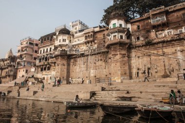 VARANASI, INDIA - DECEMBER 20: Hindus perform ritual puja at dawn in the Ganges River on December 20, 2007 in Varanasi, India