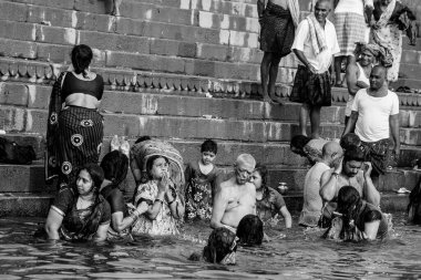 VARANASI, INDIA - NOVEMBER 15: Hindu pilgrims take a holy bath in the river ganges on November 15, 2013 in Varanasi, Uttar Pradesh, India 