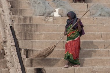 VARANASI - NOVEMBER 22: Unidentified hindu women on the sacred Ganges river banks at Dashashwamedh ghat on November 22, 2012 in Varanasi, State of Uttar Pradesh, India 