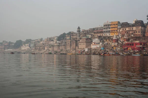 VARANASI, INDIA - DECEMBER 20: Hindus perform ritual puja at dawn in the Ganges River on December 20, 2007 in Varanasi, India