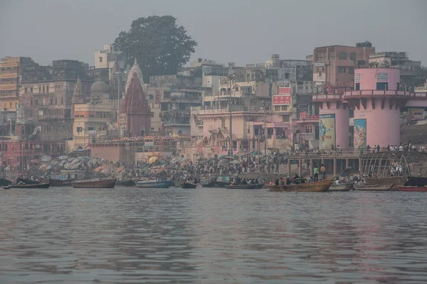 VARANASI, INDIA - DECEMBER 20: Hindus perform ritual puja at dawn in the Ganges River on December 20, 2007 in Varanasi, India