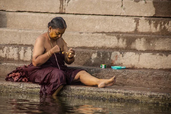 VARANASI, INDIA - NOVEMBER 15: Hindu pilgrims take a holy bath in the river ganges on November 15, 2013 in Varanasi, Uttar Pradesh, India 