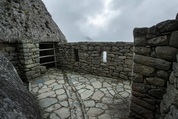 Machu Picchu ancient city view from Huchu'y Picchu in cloudy weather