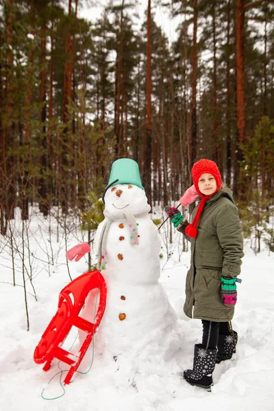 Little Girl Winter Walk Snowman Sled — стоковое фото