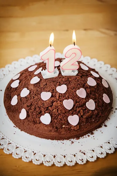 Chocolate Birthday Cake with lit candles — Stock Photo, Image
