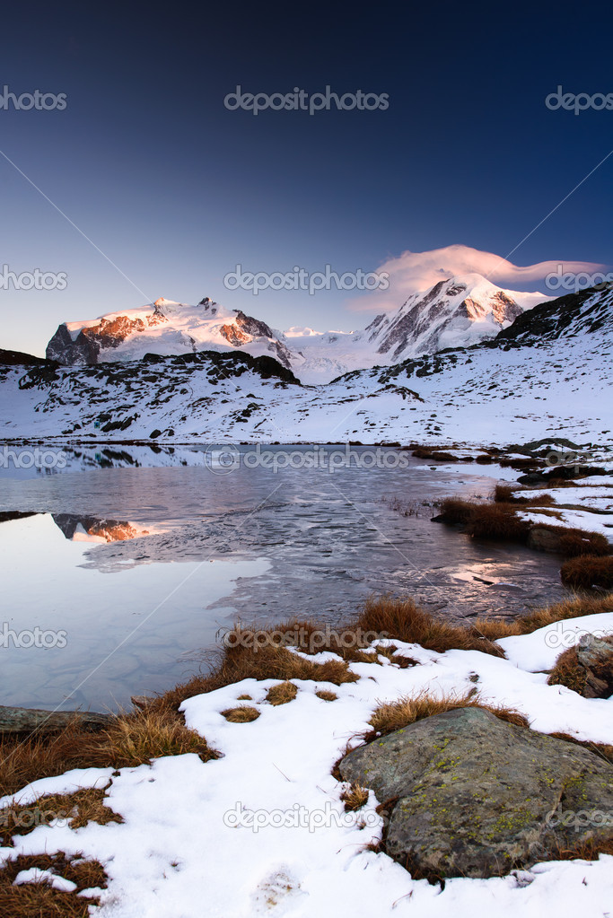 Monte Rosa an Lykamm mountain peak at sunset from Riffelsee