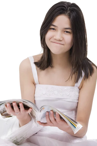 Young teenage girl in white dress gown with irritated expression — Stock Photo, Image