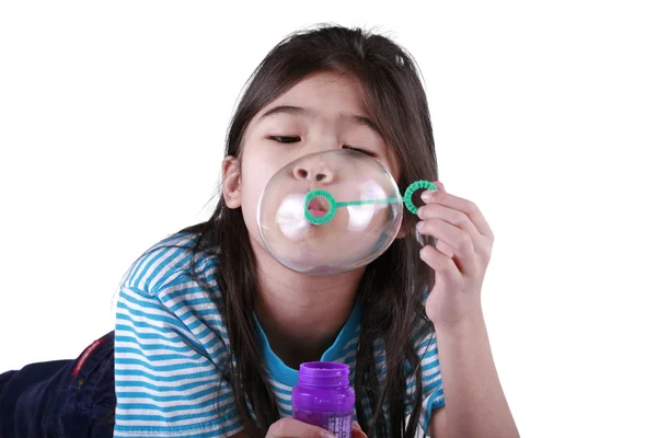 Little girl blowing bubbles — Stock Photo, Image