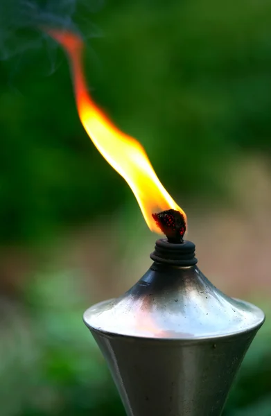 Lit torch with orange flame — Stock Photo, Image
