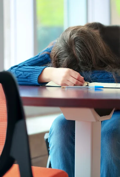 Young college or high school student asleep on table — Stock Photo, Image