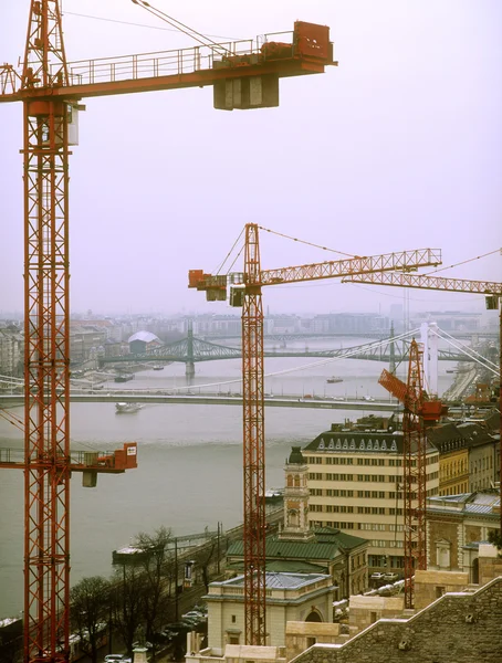 Tower cranes over a Budapest. — Stock Photo, Image