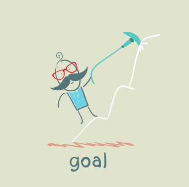 adam dağın tepesinde hedefi için tırmanıyor.