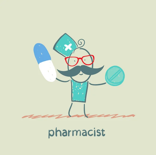 Pharmacien tenant une capsule et un comprimé — Photo
