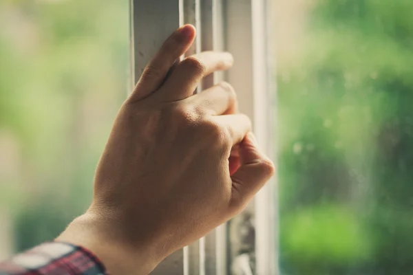 Hand opens a window — Stock Photo, Image