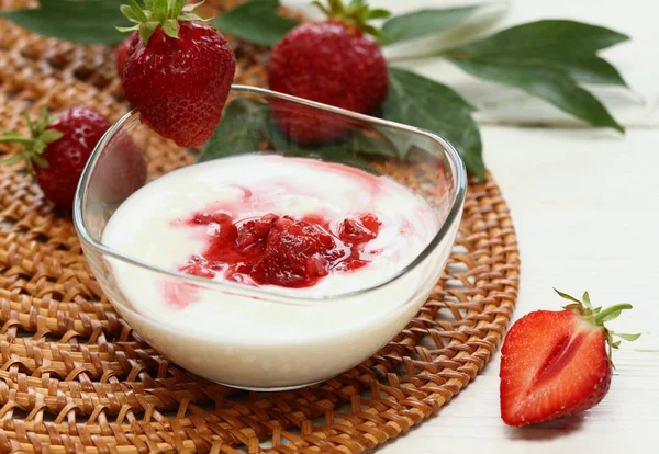 Facial mask  from yogurt and strawberries mixed together. Edible ingredients for facial mask good for complexion.