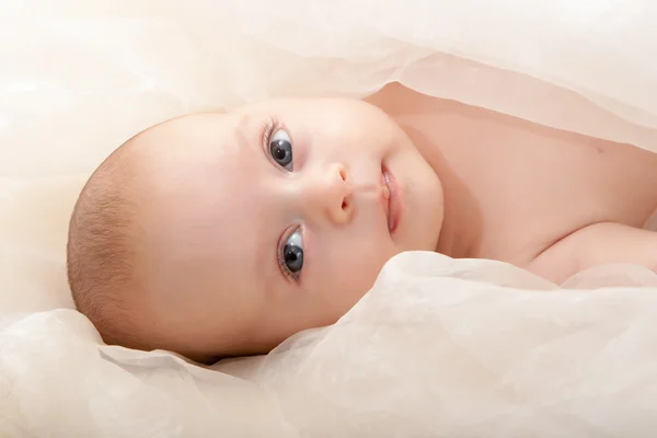 Baby face with soft cover — Stock Photo, Image