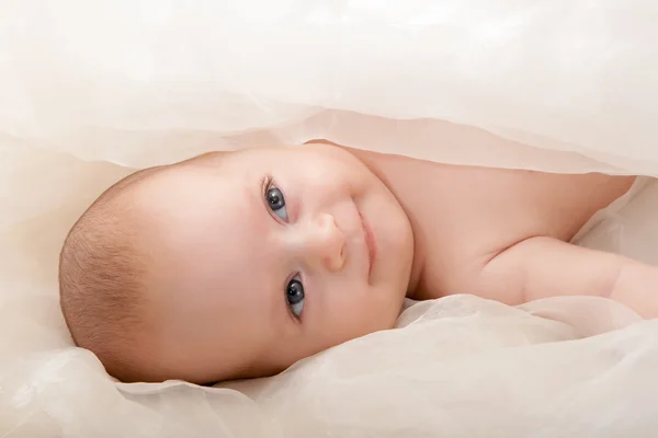 Baby face with soft cover — Stock Photo, Image