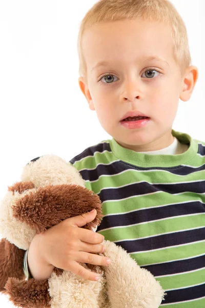 Little boy with his plush puppy. Isolated on white. — Stock Photo, Image