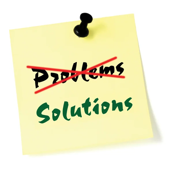 Crossing out problems, writing solutions post-it style sticky note, yellow isolated sticker, green text, black thumbtack pushpin, problem solving concept — Stock Photo, Image