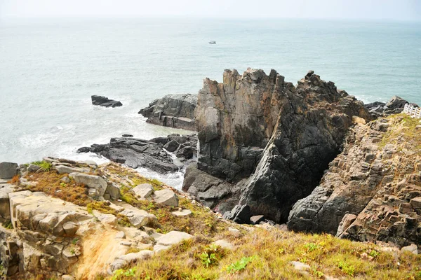 Photo Some Weathered Eroded Cracked Rocks Coastline — Zdjęcie stockowe