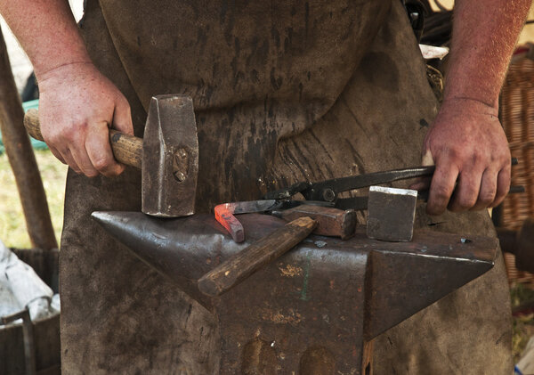 Blacksmith forged iron smith anvil hammerman