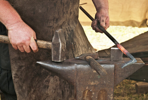 Blacksmith forged iron smith anvil hammerman