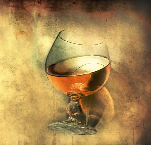 Cognac glass on grunge background — Stock Photo, Image