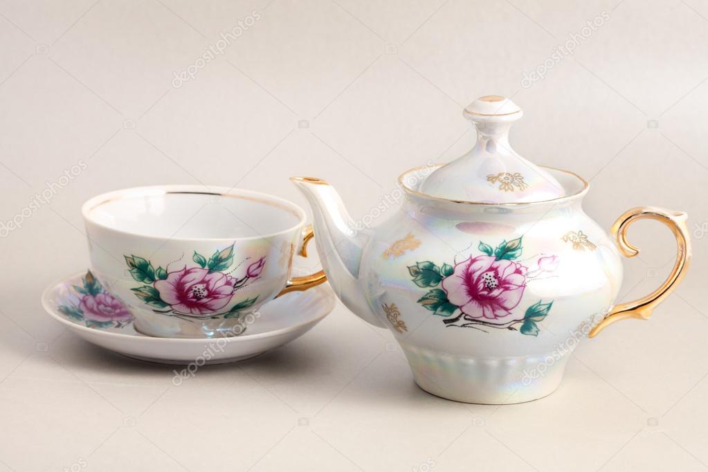Antique floral porcelain tea pot and cup Stock Photo by ©amuzica 19067013