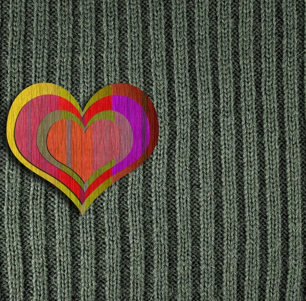 Heart on green knitted wool background — Stock Photo, Image