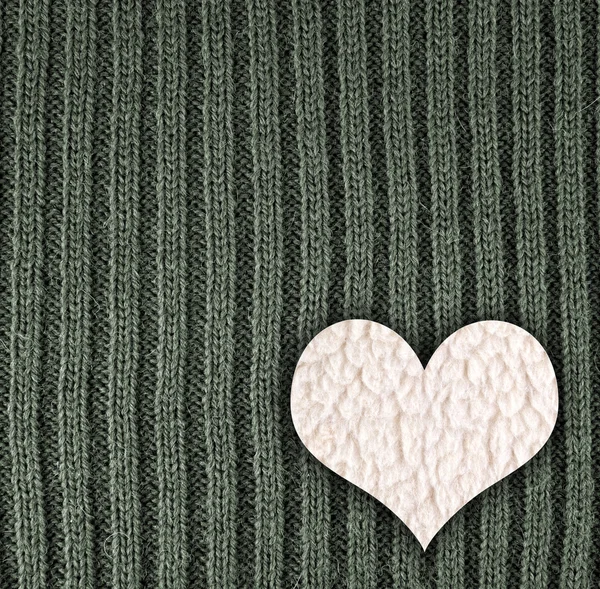 Heart on green knitted wool background — Stock Photo, Image