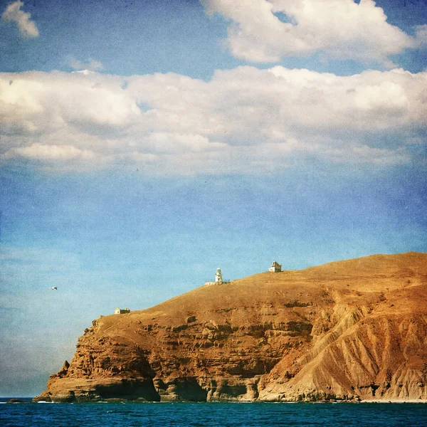 Rocky coastline and lighthouse, Crimea, Ukraine - picture in retro style — Stock Photo, Image