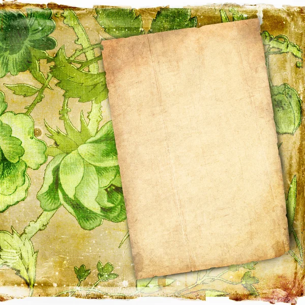 Old paper on grunge background with green flowers — Stock Photo, Image