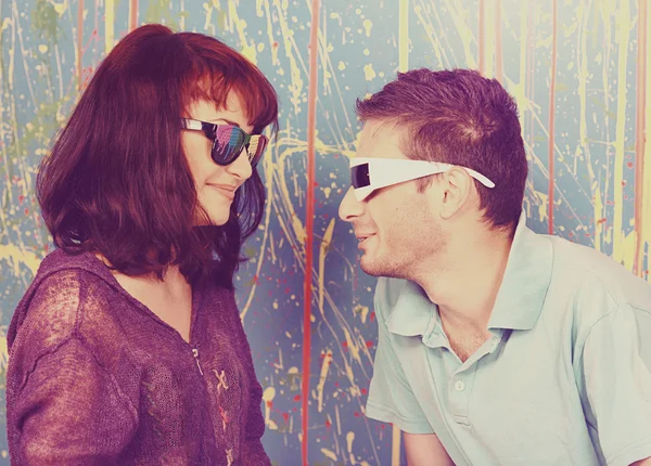 Happy young couple in funky sunglasses — Stock Photo, Image
