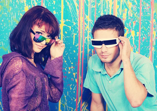 Happy young couple in funky sunglasses — Stock Photo, Image