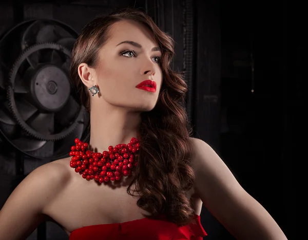 Woman with red lips and berry necklace — Stock Photo, Image