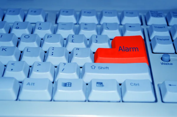 Botón de alarma rojo en el teclado del ordenador —  Fotos de Stock