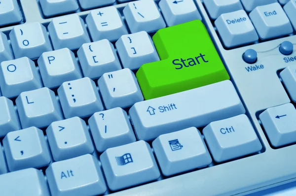 Green start button on computer keyboard — Stok fotoğraf