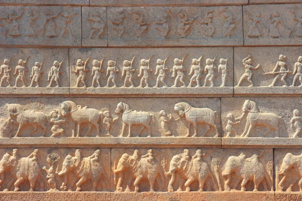 Wall with a carved relief: the Indian army