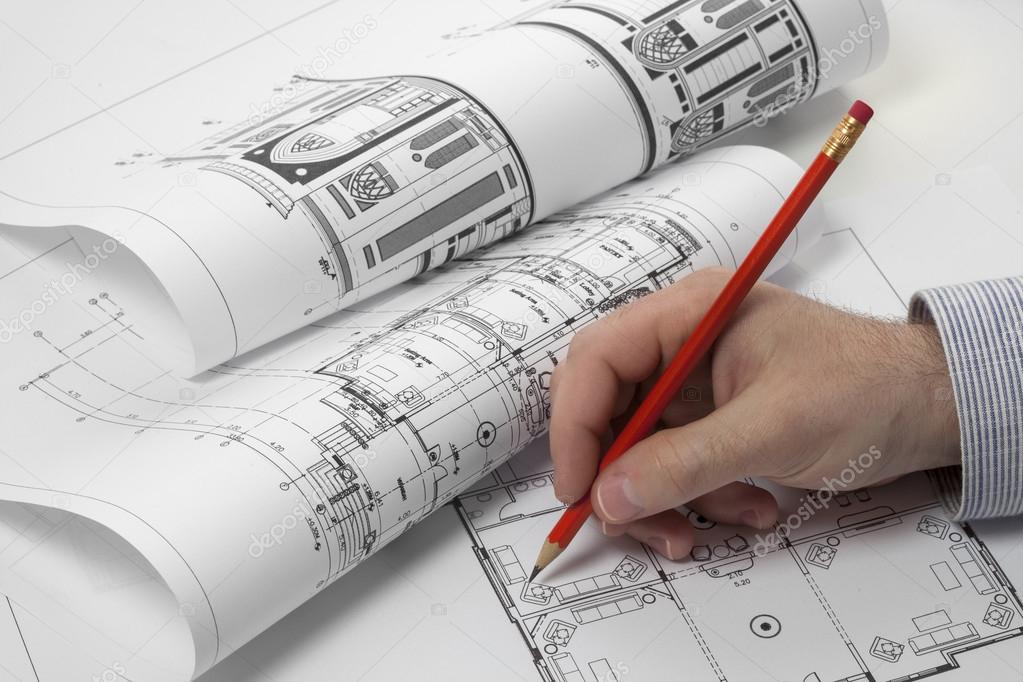 Architects planning on blueprint