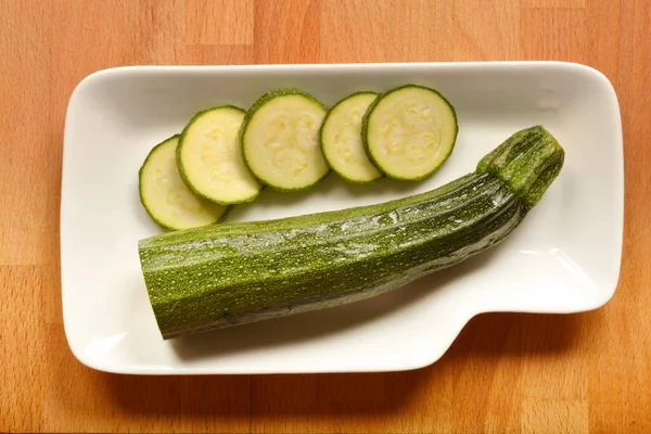 Top View Half Zucchini Fiew Slices White Plate — Stock Photo, Image