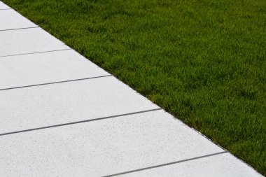 Detail of stone path and grass beside it - abstract wallpaper