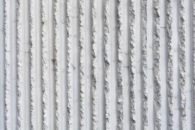 Detail of concrete facade panel with vertical embossed lines