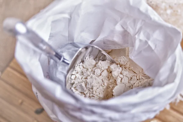 Bag of flour with scoop — Stock Photo, Image