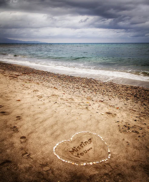 Message of a missing love in the sand — Stock Photo, Image