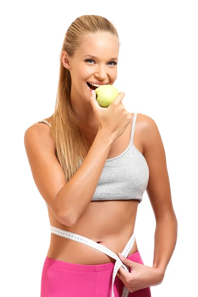 Portrait of a fitt woman with apple — Stock Photo, Image